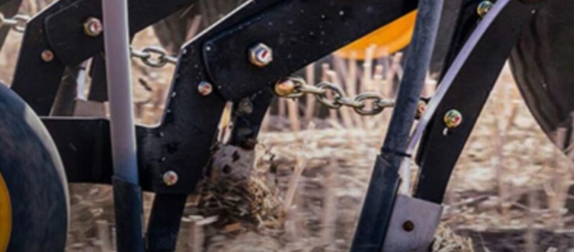 A close up of a tractor harvesting.
