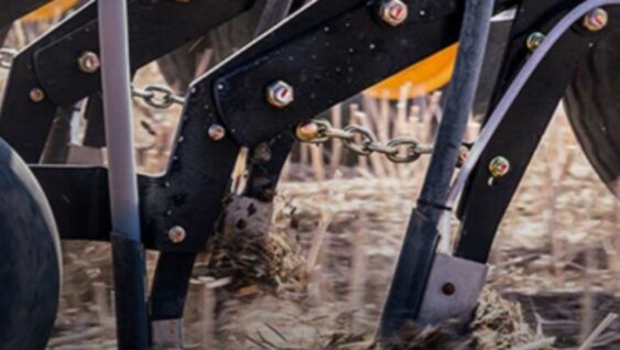 A close up of a tractor harvesting.