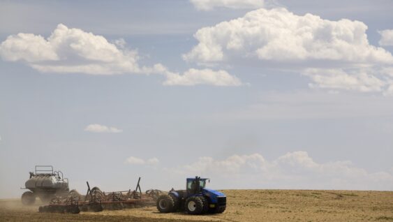 Calgary, Alberta, Canada; An Air Seeder Seeding A Field In The Spring.