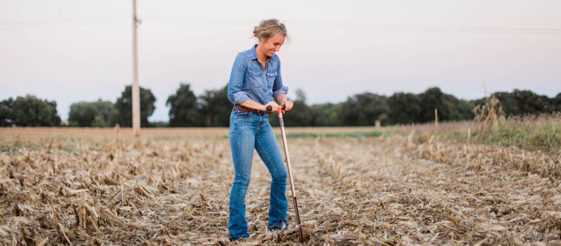 Female Farmer Taking Soil Sample