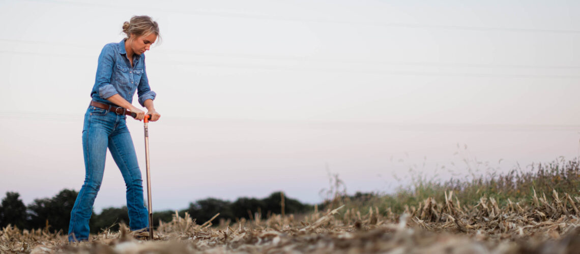 Female Farmer Taking Soil Sample