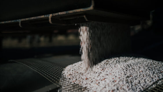 A blend of fertilizer prills preparing for application.